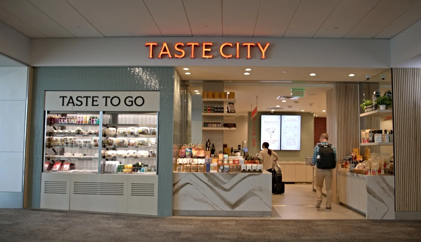 Storefront of Taste City restaurant with a grab-and-go counter